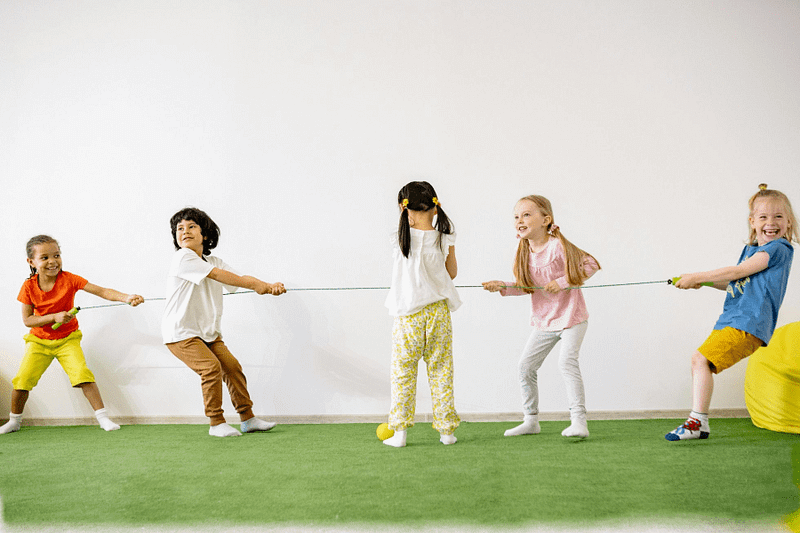 Children playing tug-of-war.