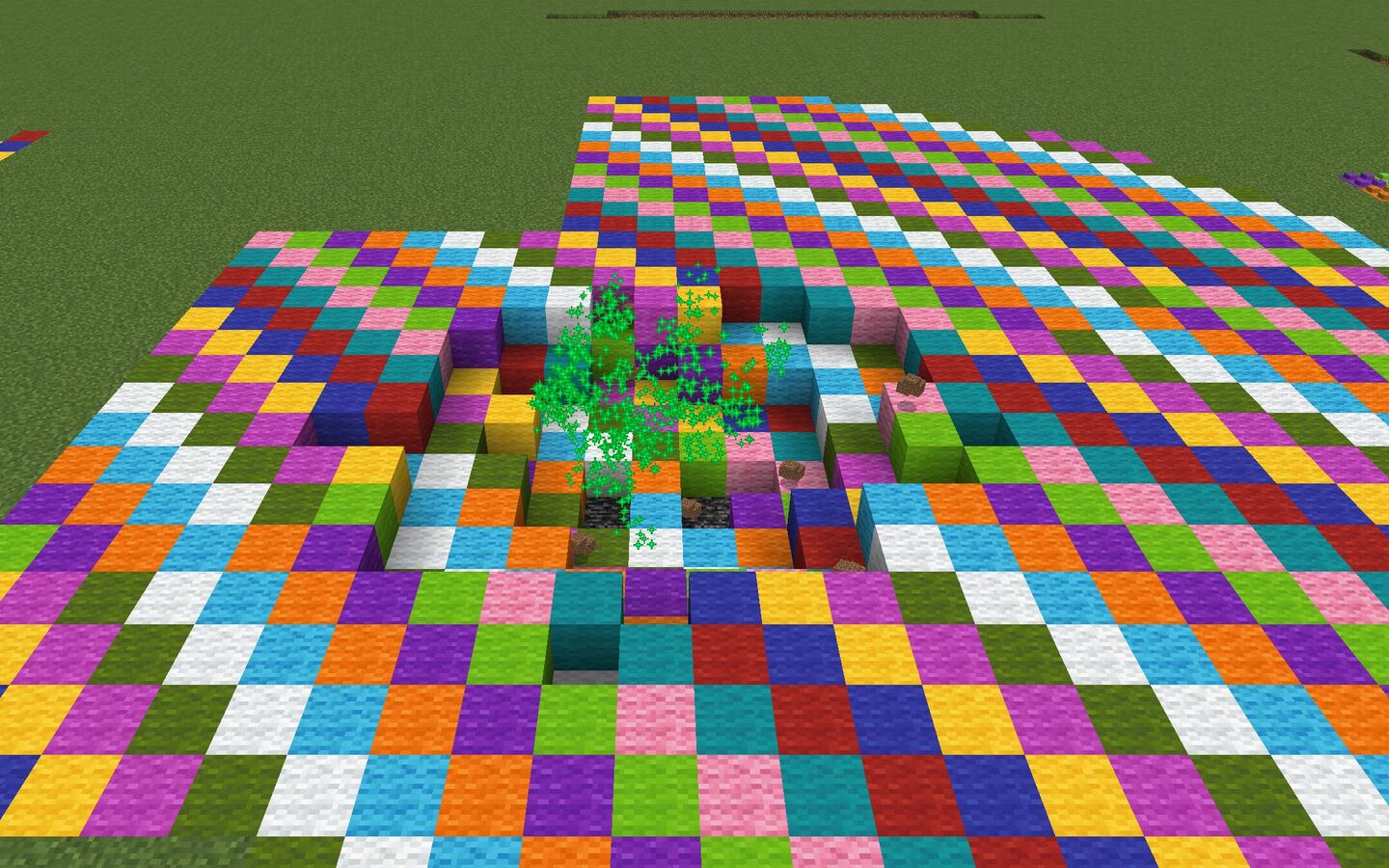 Rainbow Wool TNT: a twenty-block circle of the ground has turned into coloured wool
